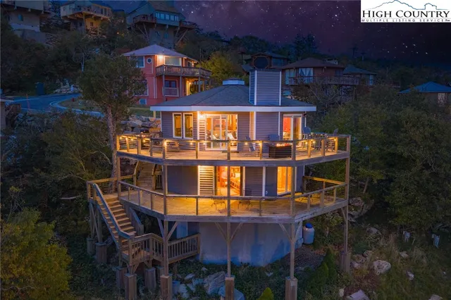 a front view of a house with yard and seating space