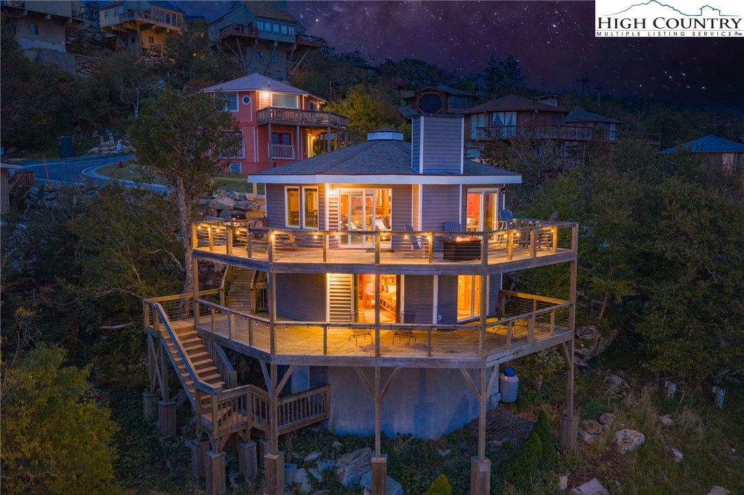 a front view of a house with yard and seating space