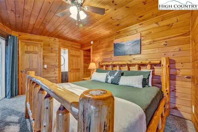 a bedroom with a bed and a night stand