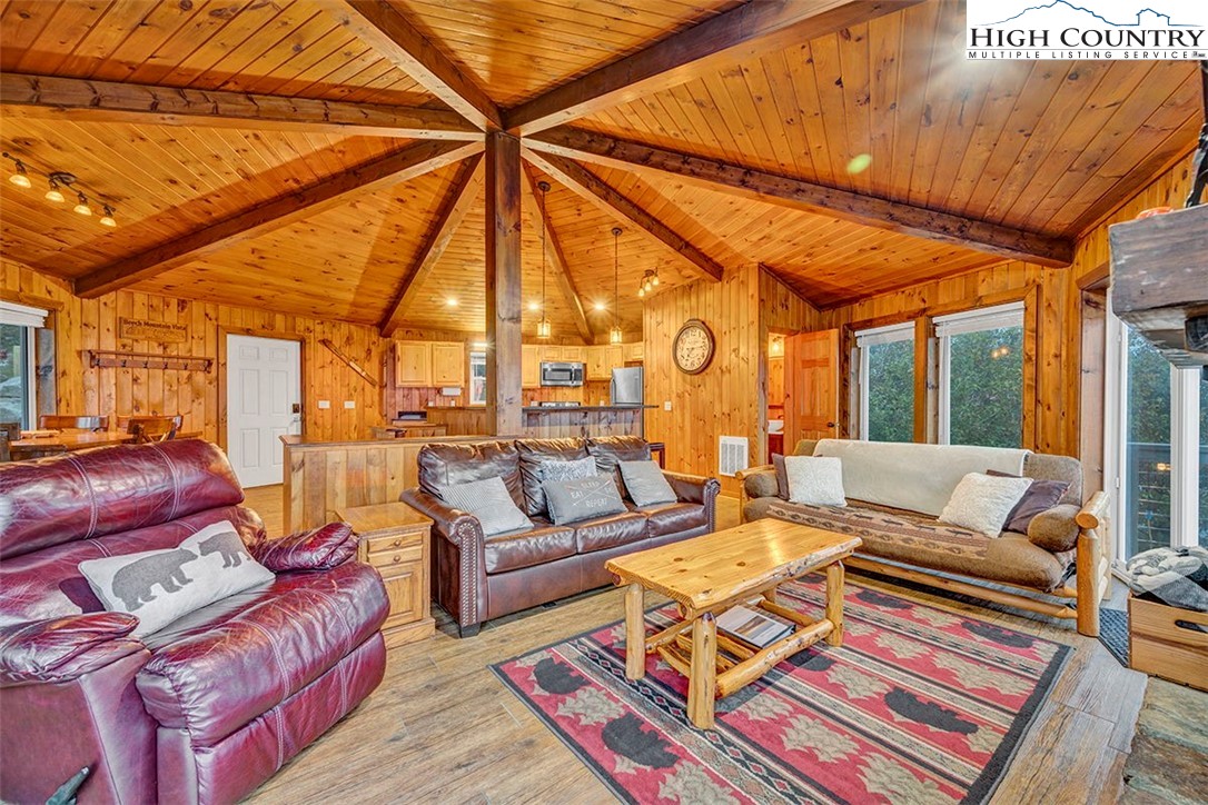 127 Skiloft Road Beech Mountain, NC 28604 - Photo 14 of 42 a living room with furniture and a table