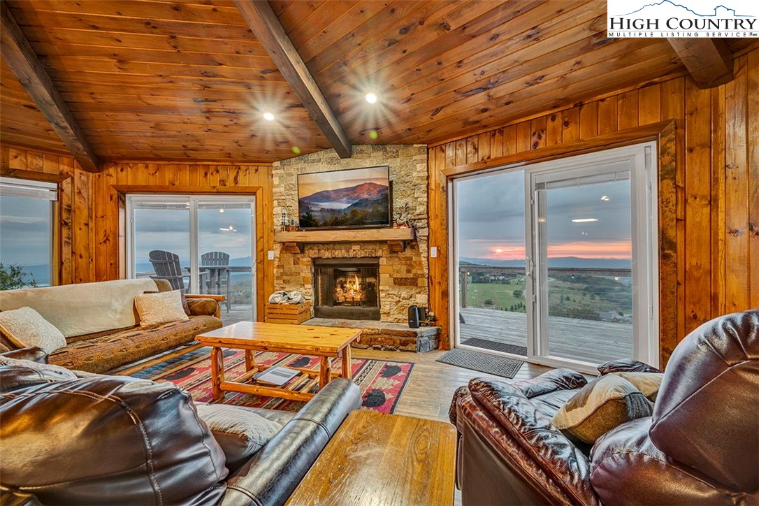 127 Skiloft Road Beech Mountain, NC 28604 - Photo 15 of 42 a living room with furniture and a flat screen tv