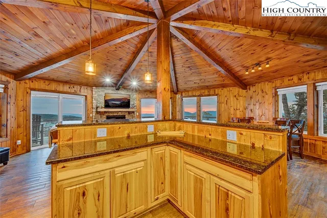 a kitchen with a sink and wooden cabinets