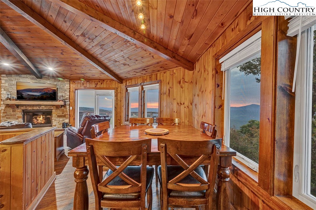 127 Skiloft Road Beech Mountain, NC 28604 - Photo 19 of 42 a view of a dining room with furniture window and outside view