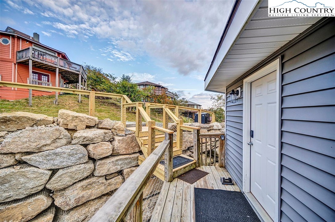 127 Skiloft Road Beech Mountain, NC 28604 - Photo 23 of 42 a view of a balcony with chairs
