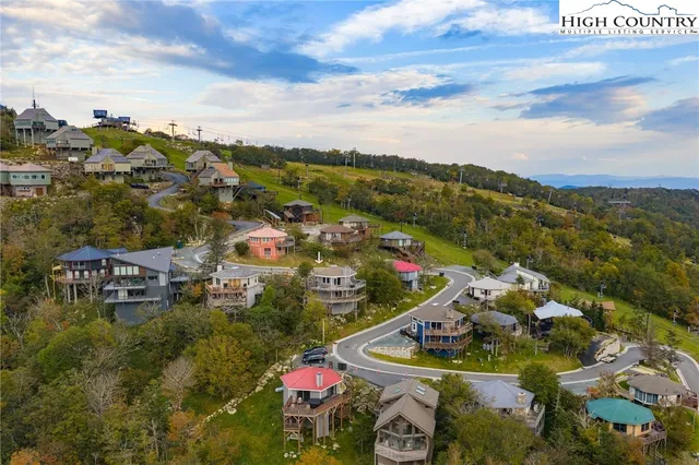 a view of a town with mountains in the background