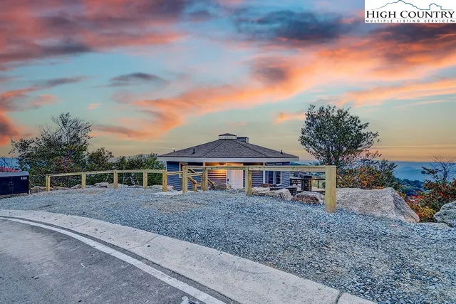 a view of a patio with a table and chairs