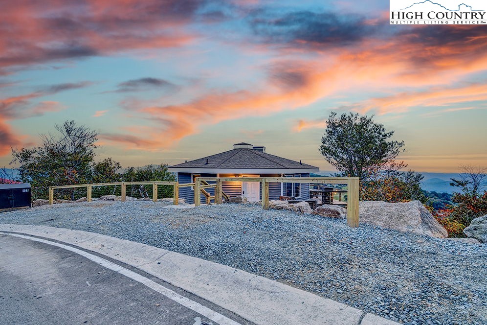 127 Skiloft Road Beech Mountain, NC 28604 - Photo 37 of 42 a front view of a house with a garden
