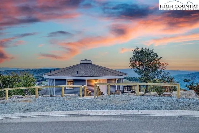 a view of a chair and table in the balcony
