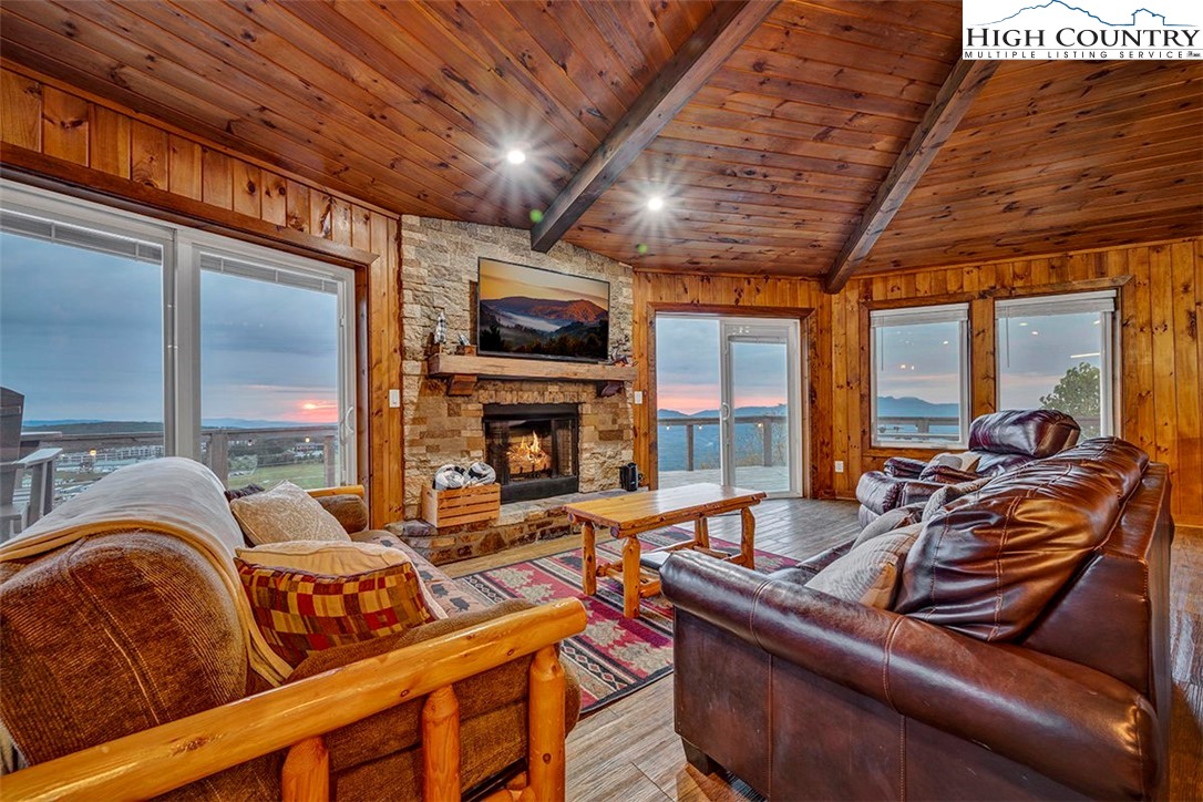 127 Skiloft Road Beech Mountain, NC 28604 - Photo 5 of 42 a living room with furniture fireplace and flat screen tv