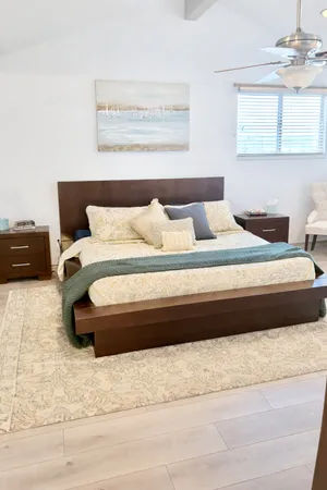 a bedroom with a bed and a couch