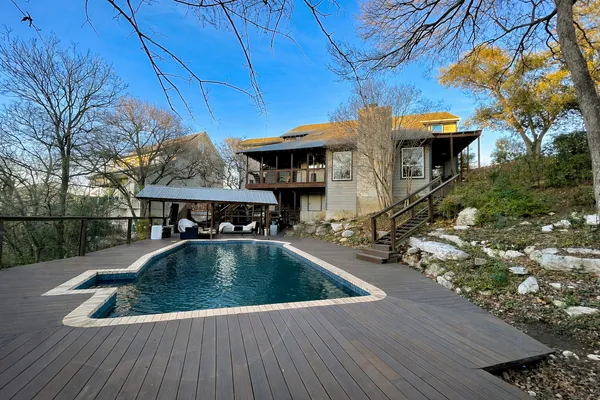 a view of swimming pool with seating space