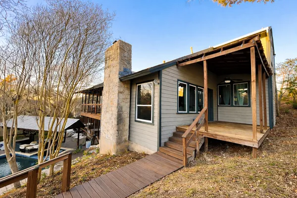 a view of house with a roof deck