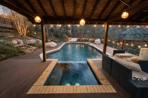 a view of swimming pool with a patio