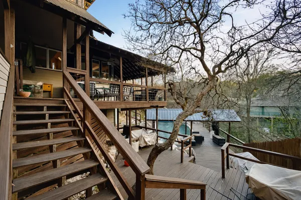 a balcony view with couple of chairs