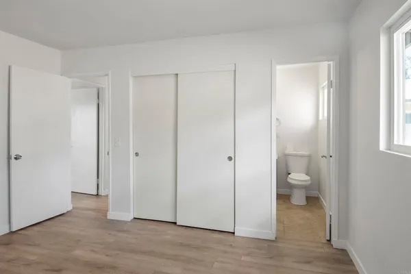 a view of room with a toilet and a bathroom view