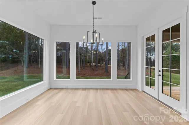 a bathroom with double sink and a mirror