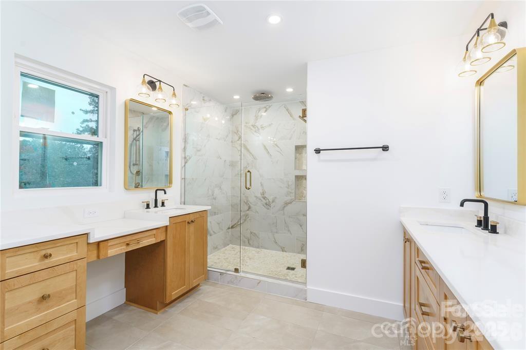 7362 Hemlock Court Denver, NC 28037 - Photo 24 of 46 a spacious bathroom with a tub sink shower and mirror