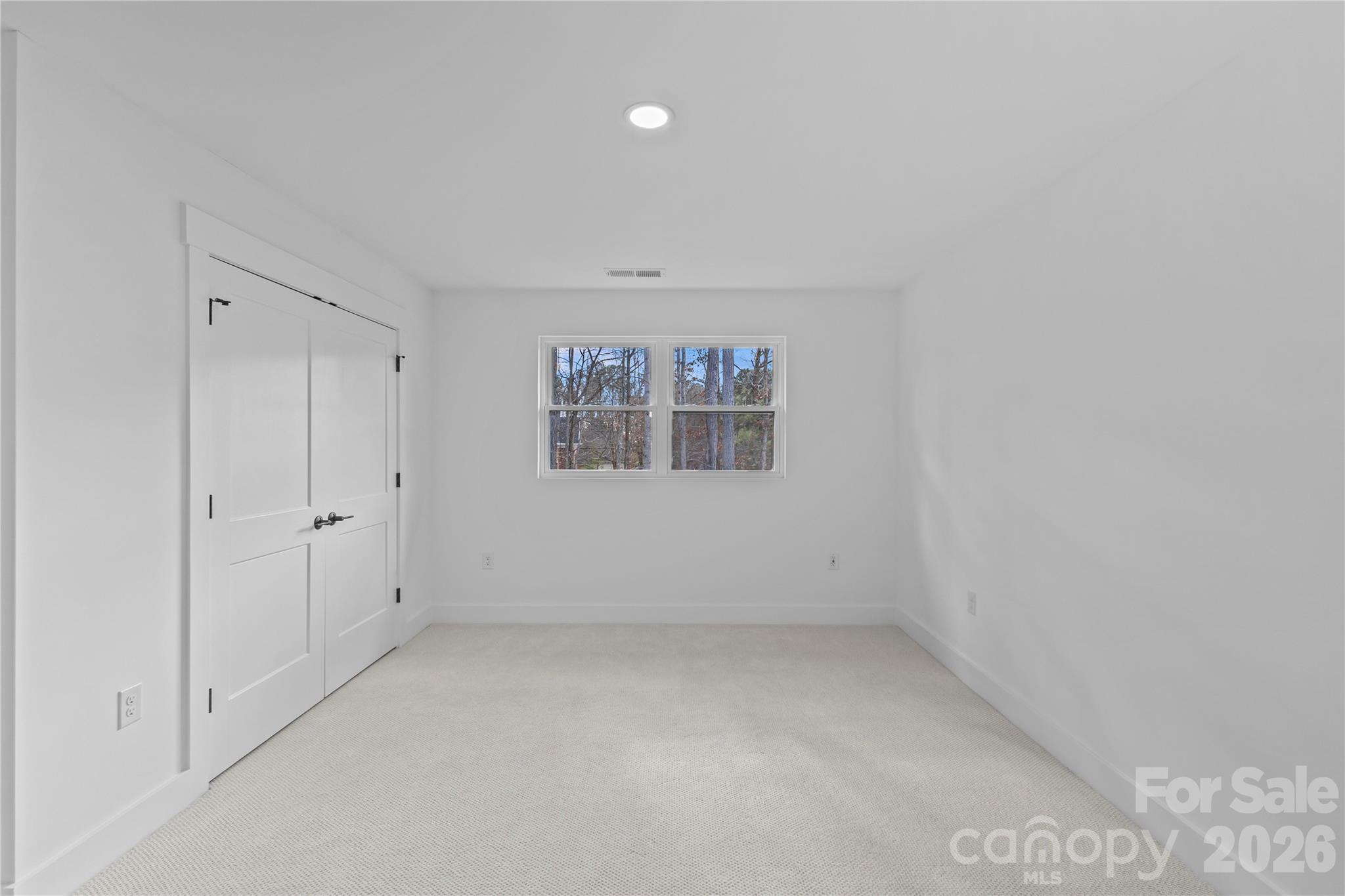 7362 Hemlock Court Denver, NC 28037 - Photo 27 of 46 a view of an empty room with a window