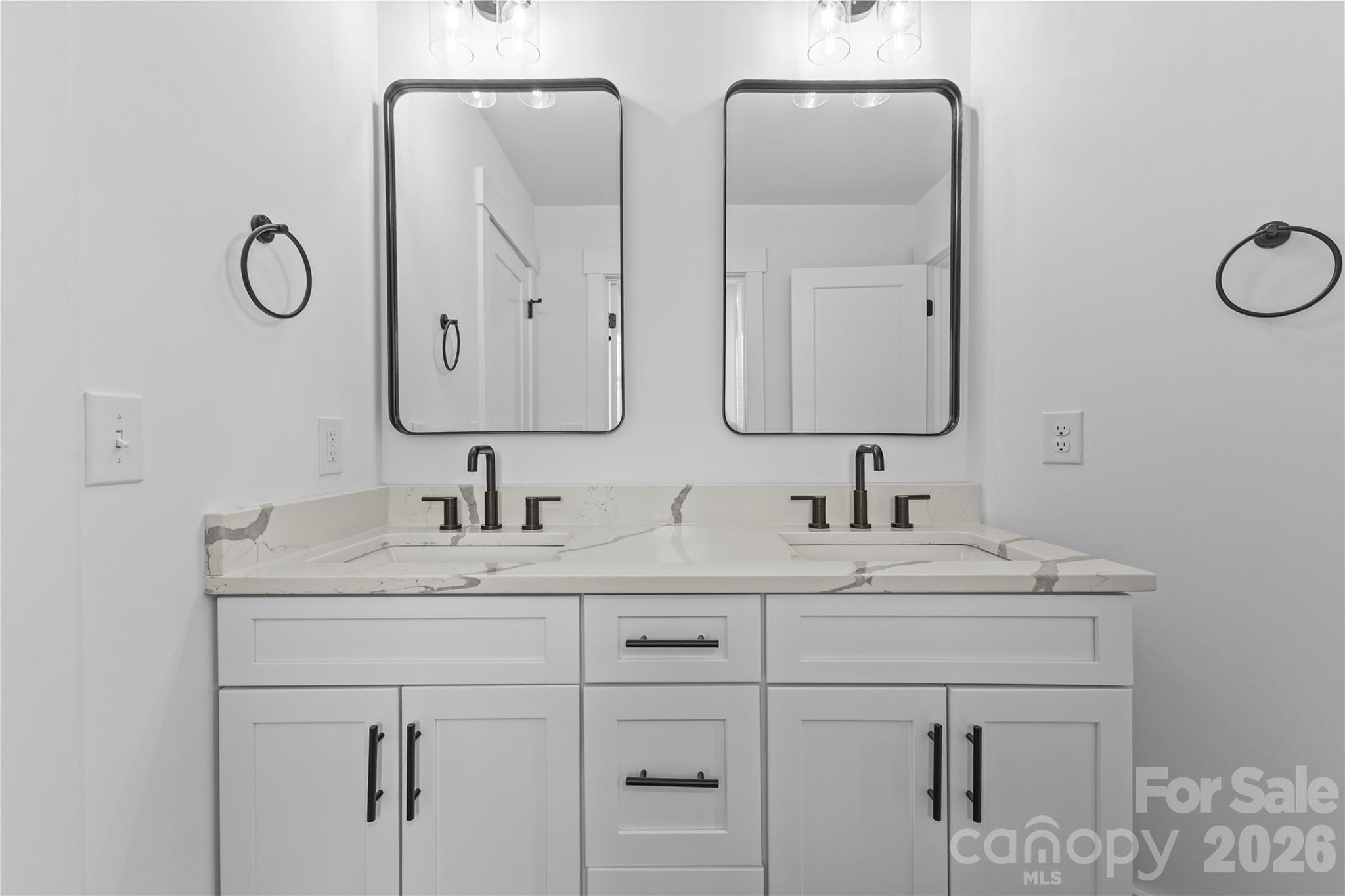 7362 Hemlock Court Denver, NC 28037 - Photo 28 of 46 a bathroom with double sink and a mirror