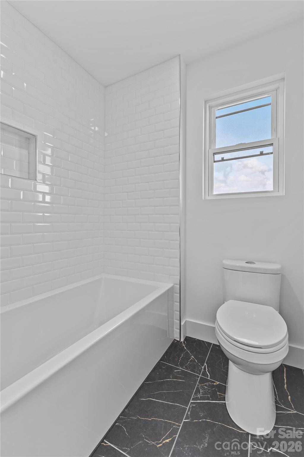7362 Hemlock Court Denver, NC 28037 - Photo 29 of 46 a bathroom with a toilet and a bathtub
