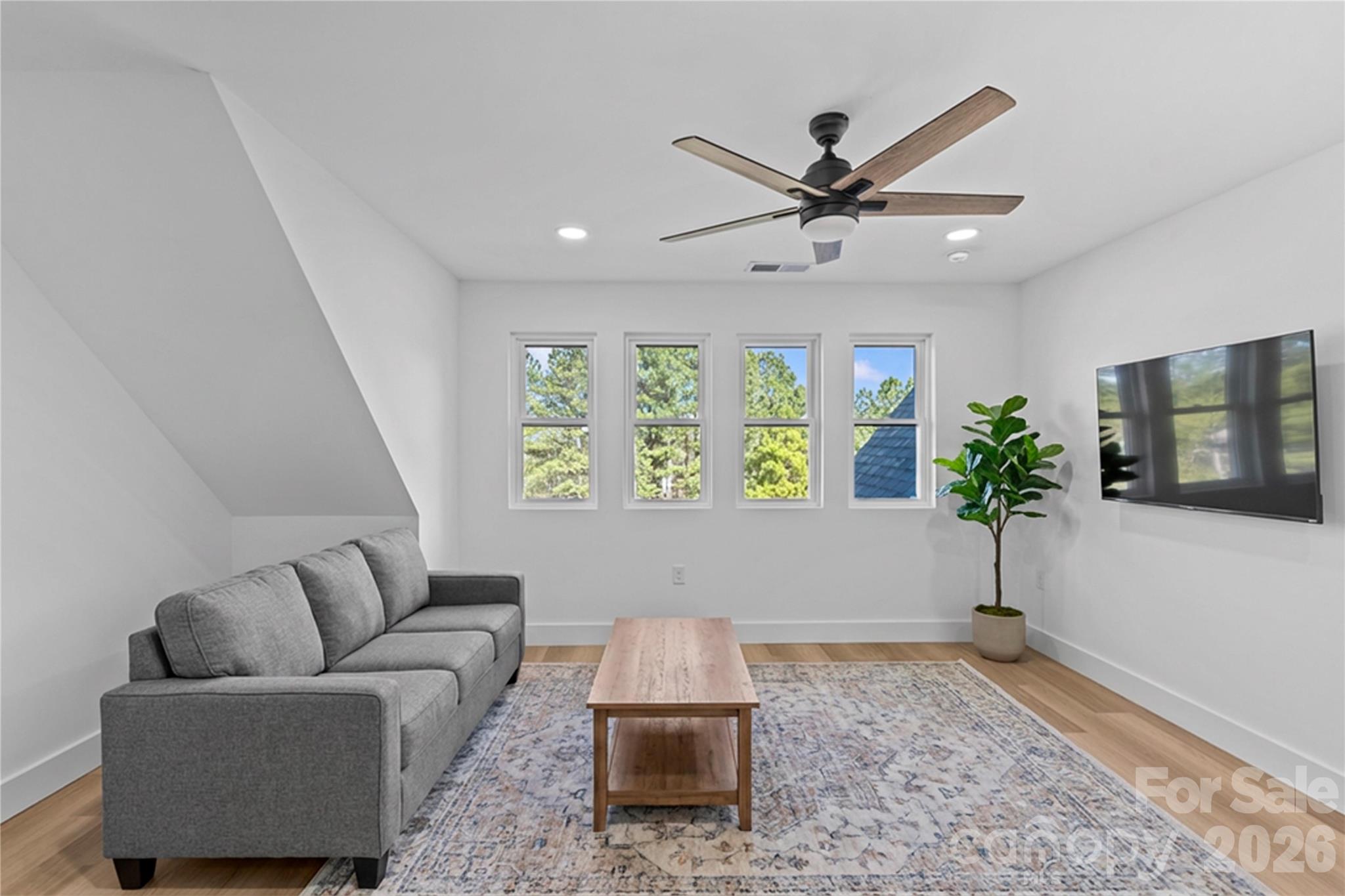 7362 Hemlock Court Denver, NC 28037 - Photo 30 of 46 a living room with furniture and a window