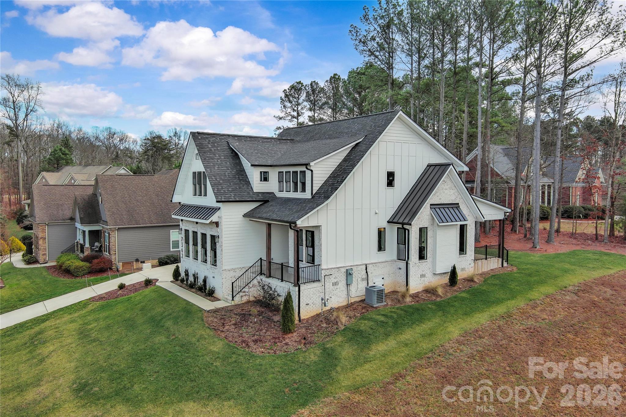 7362 Hemlock Court Denver, NC 28037 - Photo 39 of 46 a front view of a house with a yard