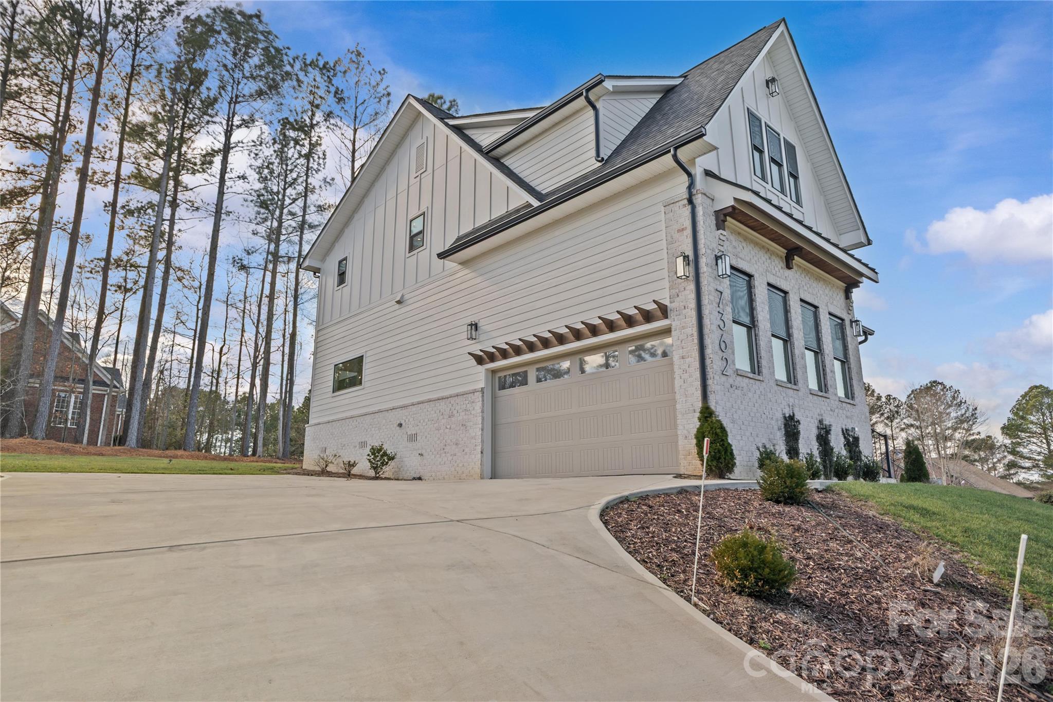 7362 Hemlock Court Denver, NC 28037 - Photo 43 of 46 a view of a white building among the street with palm trees