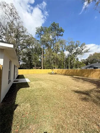 a view of swimming pool with a yard