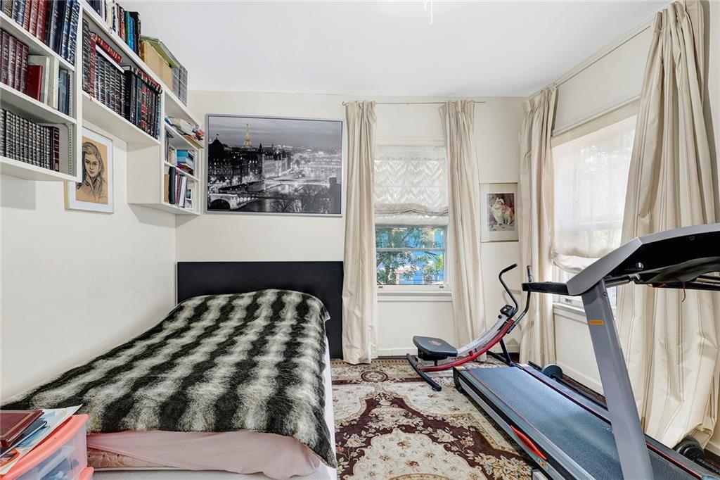511 Argyle Road Brooklyn, NY 11218 - Photo 14 of 19 a bedroom with a bed and two window