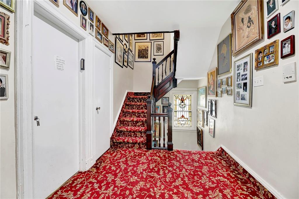 511 Argyle Road Brooklyn, NY 11218 - Photo 15 of 19 a view of a hallway with windows