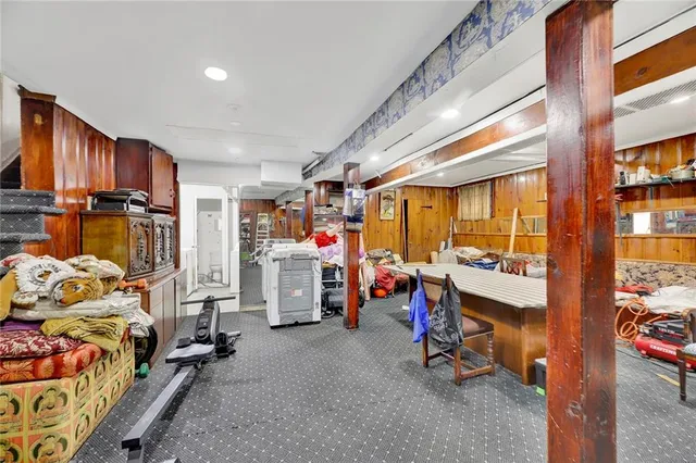 a view of a room with lots of stuff and furniture