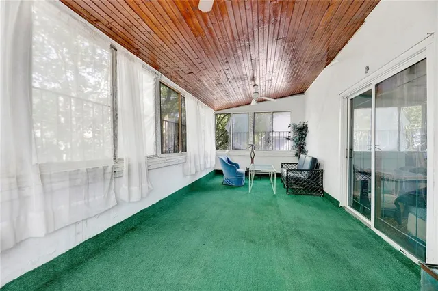 a view of an chairs with table and chairs in backyard