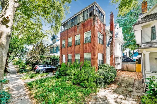 a view of a building with a yard