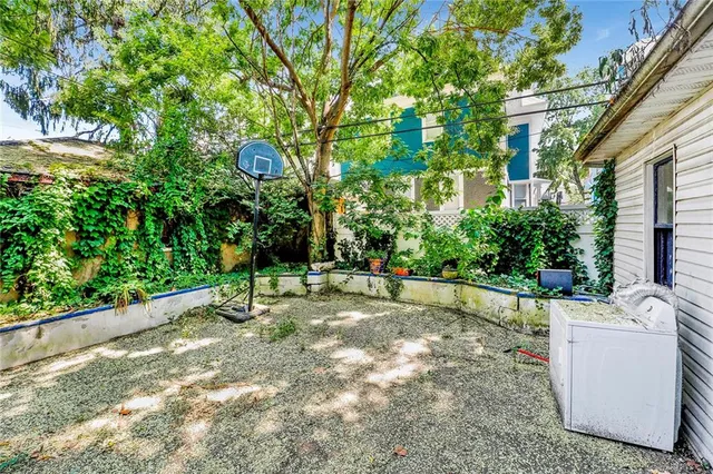 a view of a backyard with a white house