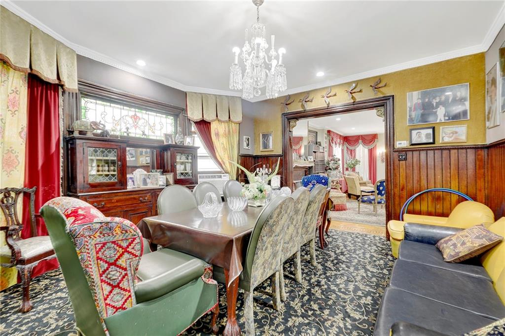 511 Argyle Road Brooklyn, NY 11218 - Photo 10 of 19 a living room with furniture chandelier and a large window