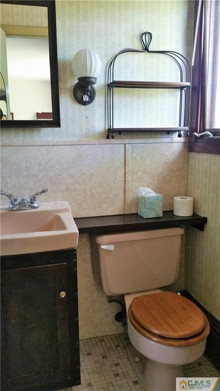 1 Maida Road Edison, NJ 08820 - Photo 11 of 17 a bathroom with a toilet a sink and mirror