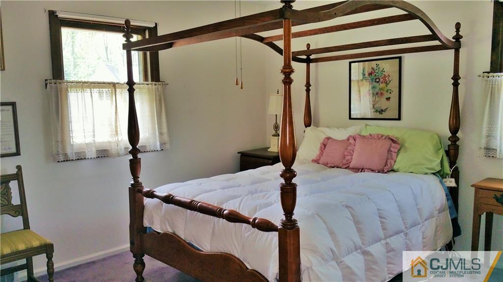 1 Maida Road Edison, NJ 08820 - Photo 12 of 17 a bedroom with a bed and a window