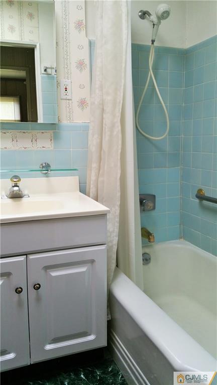 1 Maida Road Edison, NJ 08820 - Photo 13 of 17 a bathroom with a sink a toilet and shower