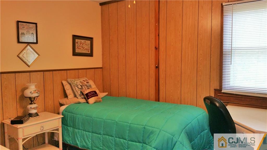 1 Maida Road Edison, NJ 08820 - Photo 14 of 17 a bedroom with a bed and a window