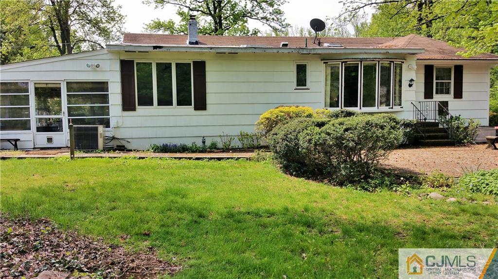 1 Maida Road Edison, NJ 08820 - Photo 16 of 17 a front view of a house with a yard