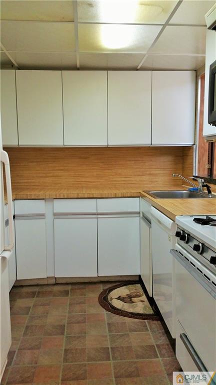 1 Maida Road Edison, NJ 08820 - Photo 4 of 17 a kitchen with a sink and cabinets
