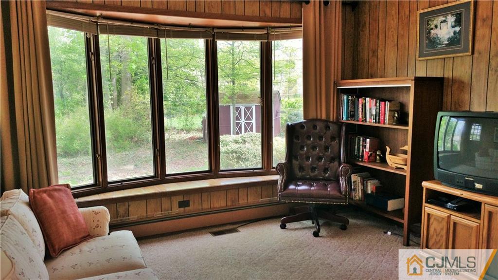 1 Maida Road Edison, NJ 08820 - Photo 8 of 17 a living room with furniture fireplace and a window