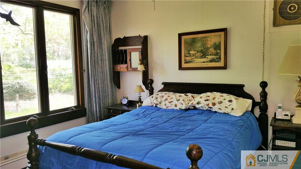 1 Maida Road Edison, NJ 08820 - Photo 10 of 17 a bedroom with a bed and a window