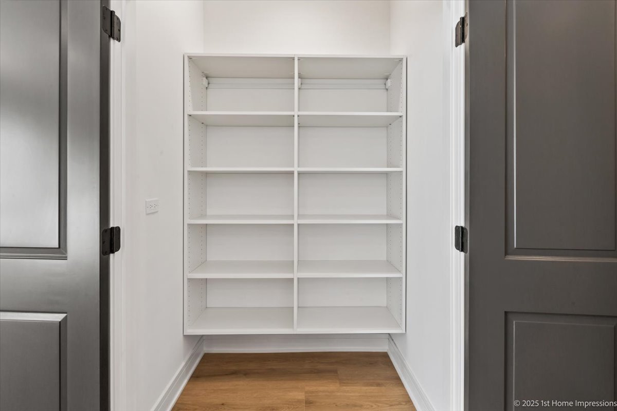 4932 South Champlain Avenue Chicago, IL 60615 - Photo 12 of 27 a view of walk in closet with empty racks