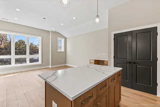 a kitchen with a stove a refrigerator and a sink
