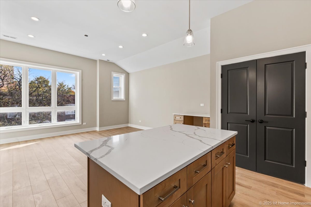 4932 South Champlain Avenue Chicago, IL 60615 - Photo 9 of 27 a kitchen with a stove a refrigerator and a sink