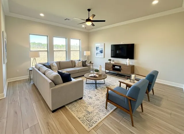 a living room with furniture and a flat screen tv
