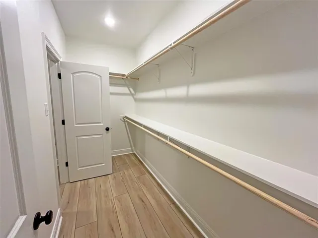 a hallway with wooden floor