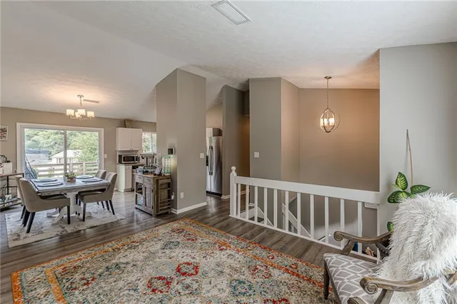 a living room with furniture and a table