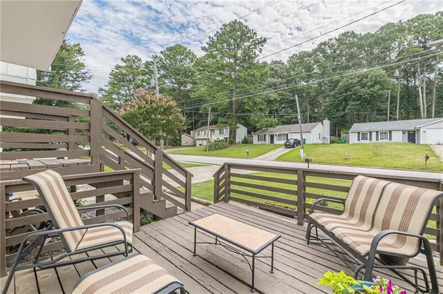a view of a chairs and table in the patio